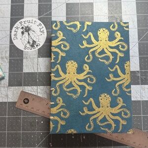 Gold octopus cover design. Hand Sewn Artist Journal Made in Alaska